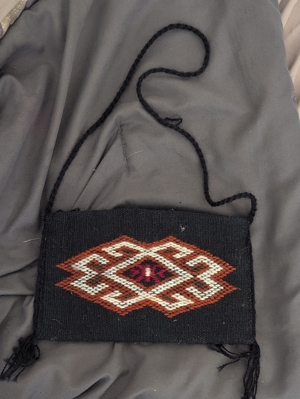 Handwoven Persian Jajim or Kilim wool pouch bag, featuring authentic tribal/noma
